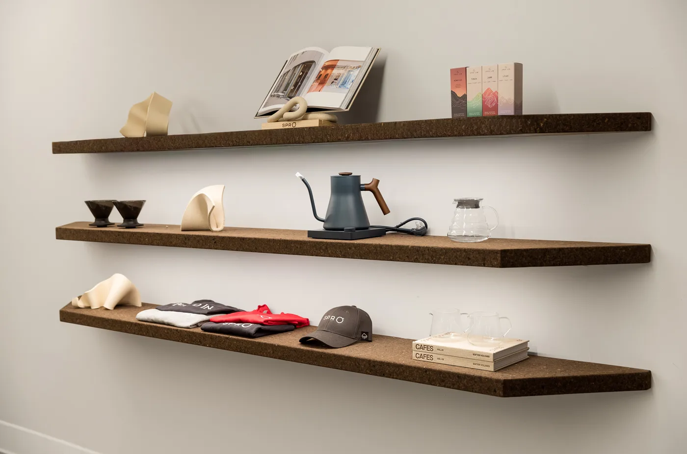 Cork floating shelves with retail display at Spro Coffee Lab