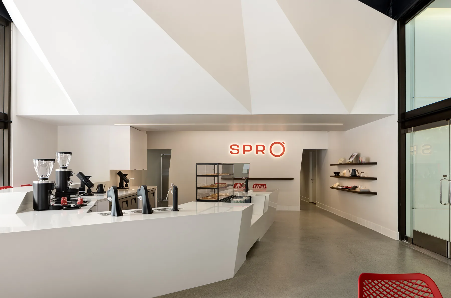 Spro Coffee Lab interior with matte laminate counter and cork millwork by Coffey Custom Builds